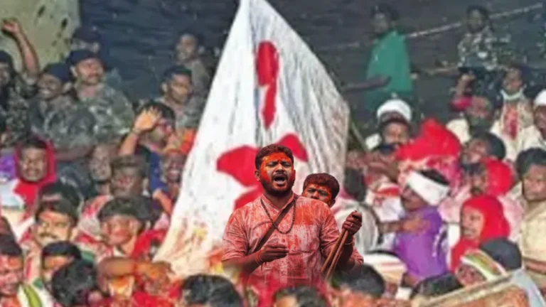 A devotee with folded hands praying emotionally during the Saralamma procession at Medaram Jatara 2026 amidst a massive crowd.
